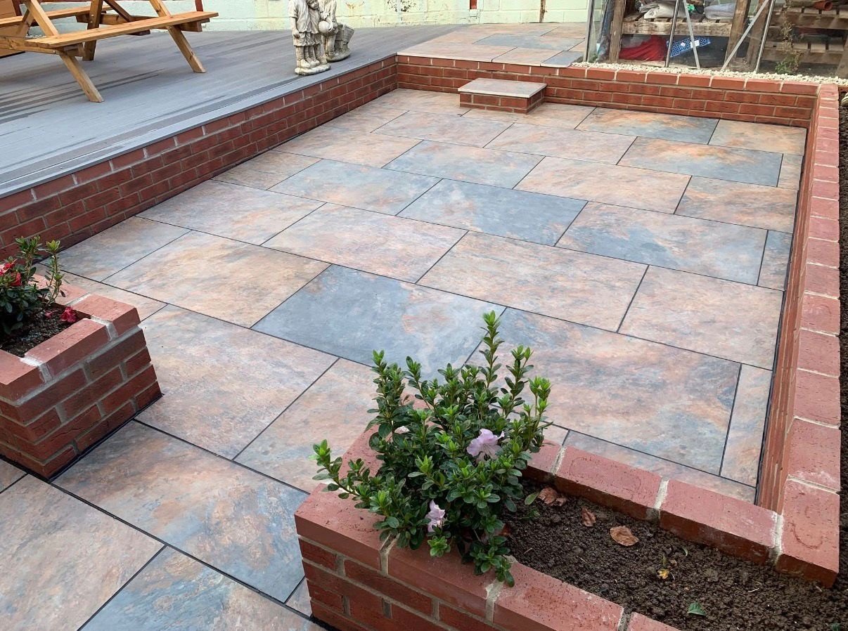 Sandstone patio with brick borders, built in Yeovil